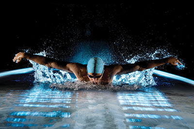 man swimming in a pool