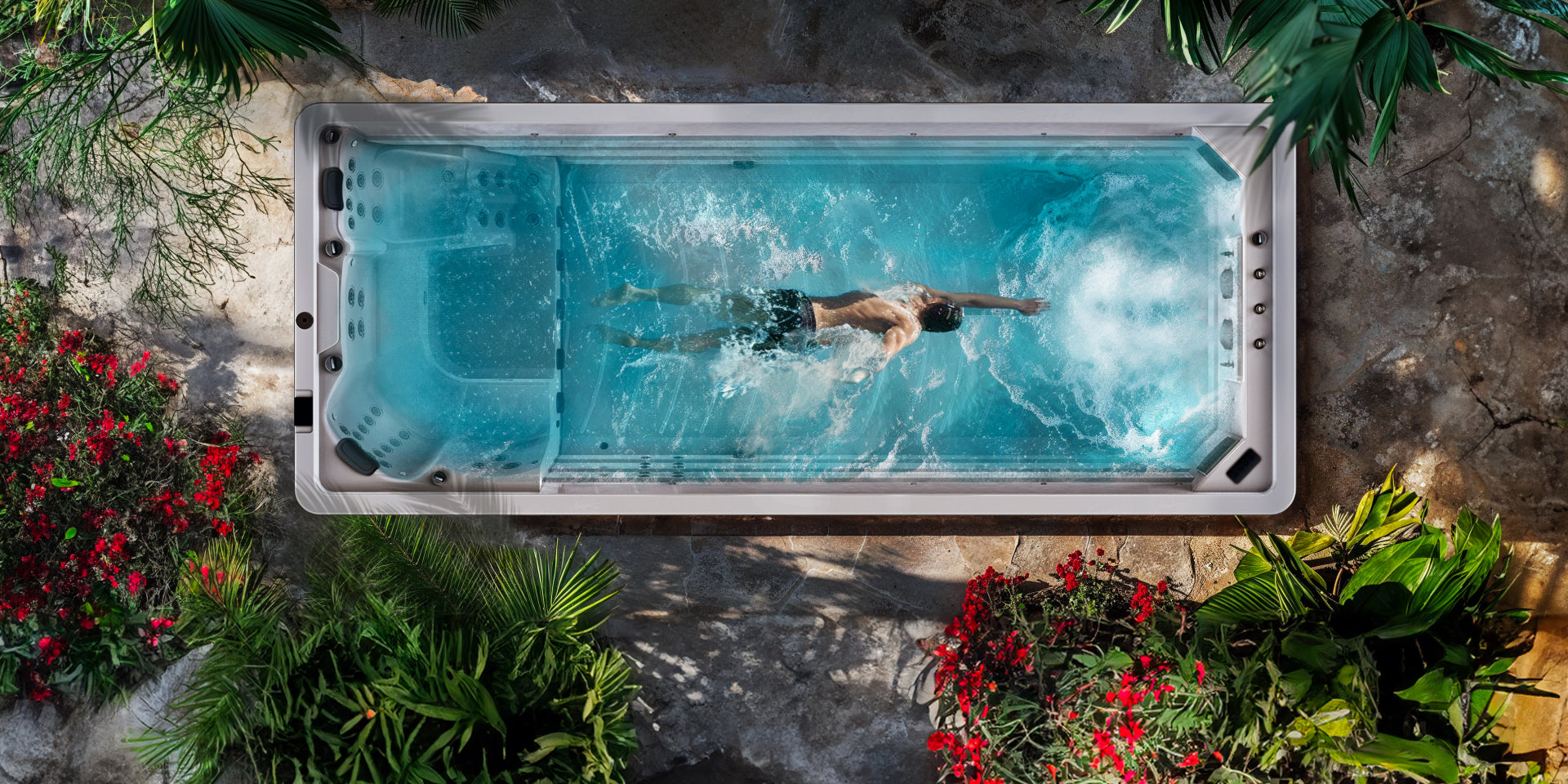 a man swimming in swim spa