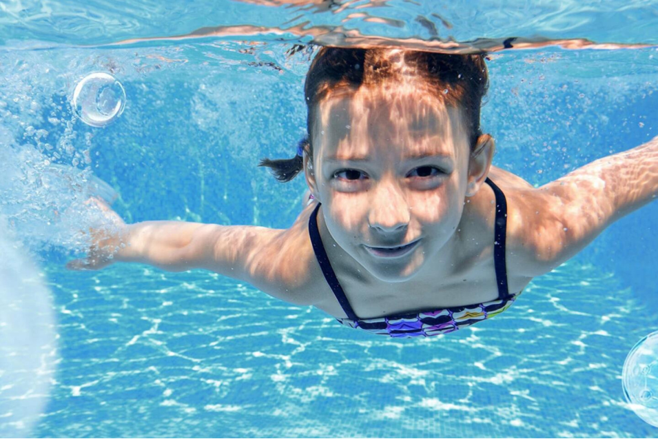 small girl in clean water