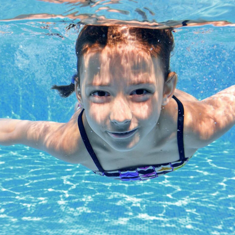 small girl in clean water